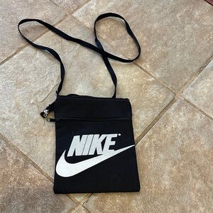 Nike Black Crossbody Pouch with White Swoosh approx 4” x 6”.
